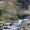 Río Negro, puente, presa y molino en la margen izquierda